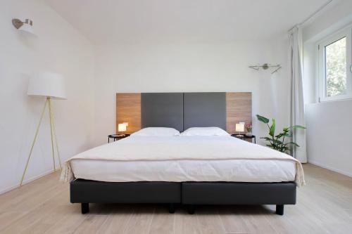 Letto o letti in una camera di Siena Hills Apartments