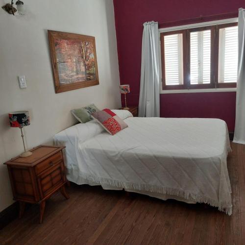 a bedroom with a bed and a window at BELGRANO in Chivilcoy