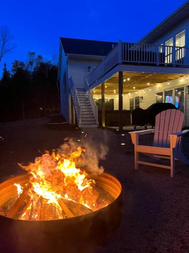 a fire pit in front of a house at night at The Ephraim House in Ephraim