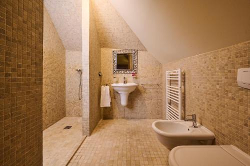 a bathroom with a sink and a toilet at Art Apartments Sievering in Vienna