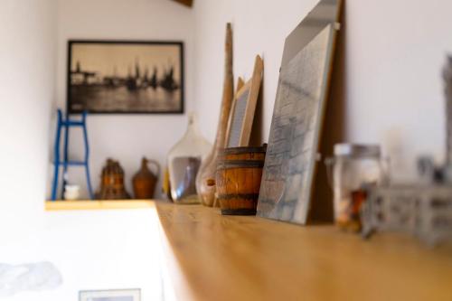 a counter top with a bunch of items on it at Holiday Home Svjetlana in Risika