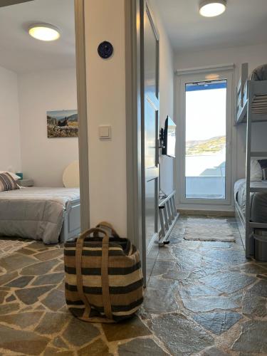 a suitcase sitting in a room with a bedroom at Sea views - Marble Palace - 2 floors in Tinos