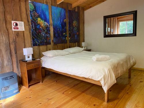 Llit o llits en una habitació de Hostal Plaza Chiloe