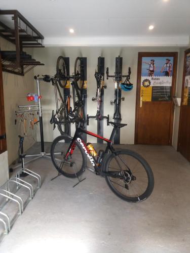 a bike is parked in a garage at Casa Ríos in Biescas