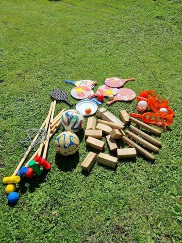 a group of toys on the grass next to chopsticks at Apartment Enebacken close Göteborg in Mölnlycke