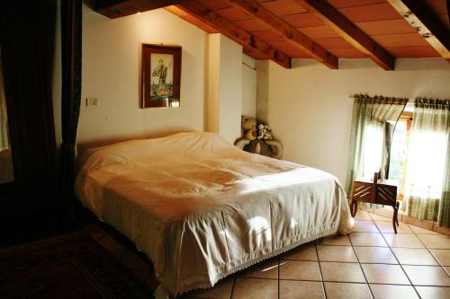 a bedroom with a bed in a room at B&B La Bugia di Villa Tanzi in Parma