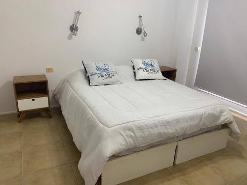 En eller flere senge i et værelse på My Place apartamentos - BELGRANO