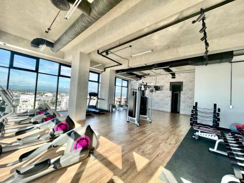 a gym with rows of pilates equipment in a room at JRVII in Santo Domingo