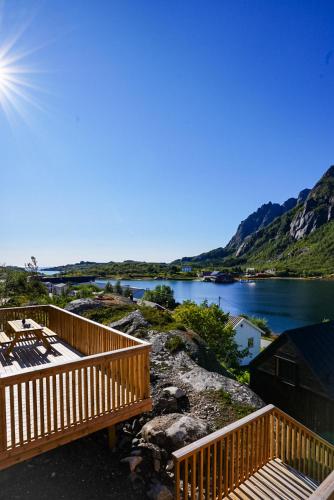 a view of a river from a deck with a view at Lofoten Cabins in Hopen