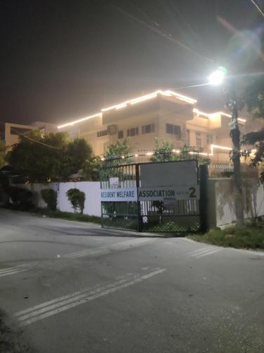 a fence in front of a house at night at Ankhi's Villa with Parking in Amritsar