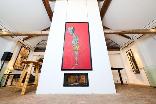 a painting of a woman on a wall in a room at Art Apartments Sievering in Vienna