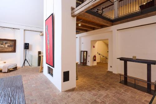 a room with a table and a painting on a wall at Art Apartments Sievering in Vienna