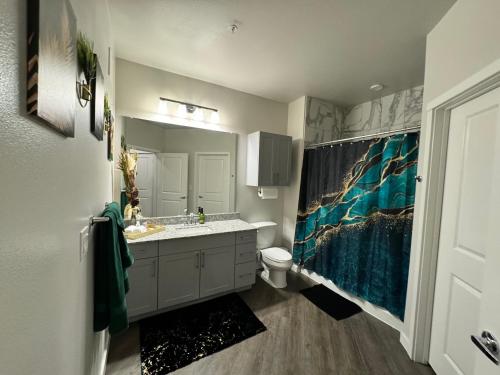 a bathroom with a sink and a toilet at Cozy Comfort Lux in Houston