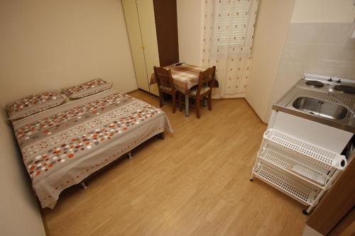 Postel nebo postele na pokoji v ubytování Apartments Lidus