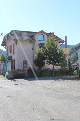 a fire hydrant in front of a house at La Riveraine et les bicyclettes in Saint-Sauveur-de-Montagut