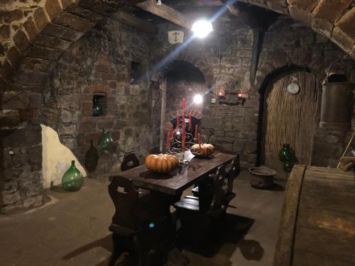 a room with a table with pumpkins on it at Antica residenza La Rocca in Montefiascone