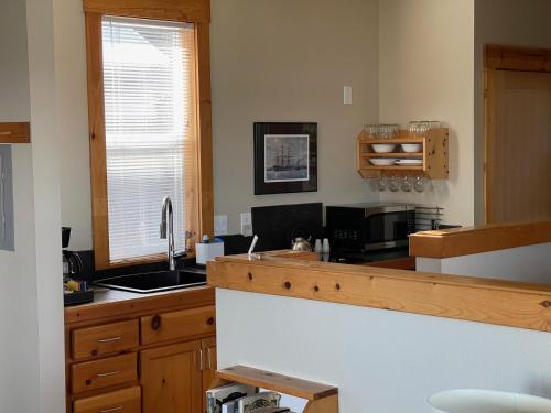 a kitchen with a sink and a counter top at BOATYARRD Inn # 9 in Langley