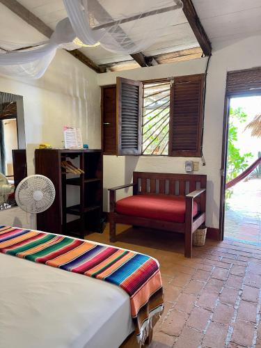 En eller flere senge i et værelse på Posada Mexico
