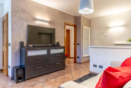 a living room with a tv and a couch at LaStefyHome in Civezzano