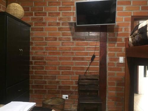 TV a/nebo společenská místnost v ubytování Cabaña Don Pacho