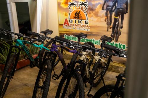 a group of bikes parked in front of a sign at Pousada Ceará - Porto das Dunas in Aquiraz