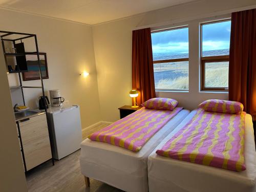 Staðarflöt Apartmentsにあるベッド