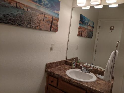 a bathroom with a sink and a mirror at Beautiful view from a peaceful place in St. George Island