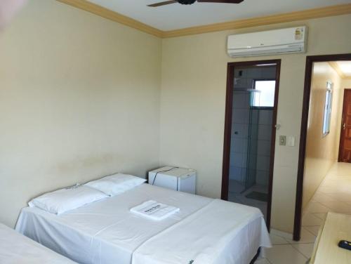 Ένα ή περισσότερα κρεβάτια σε δωμάτιο στο Hotel Algaroba Anexo