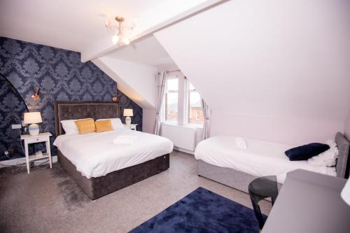 a bedroom with two beds and a window at SO-LUX in Belfast