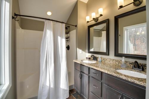 a bathroom with two sinks and a shower at Wintergreen Resort Home Close to Slopes and Trails in Nellysford
