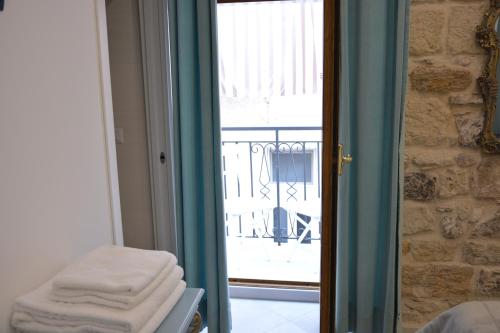 a sliding glass door with a view of a balcony at DIMORA DEL CARMINE in Bari