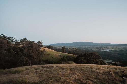a view from the top of a hill at Hilltop Off Grid Tiny House with Outdoor Bath 