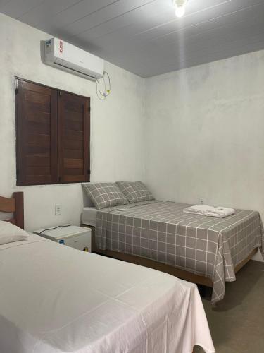 Cama ou camas em um quarto em Sítio Paraíso do Caju