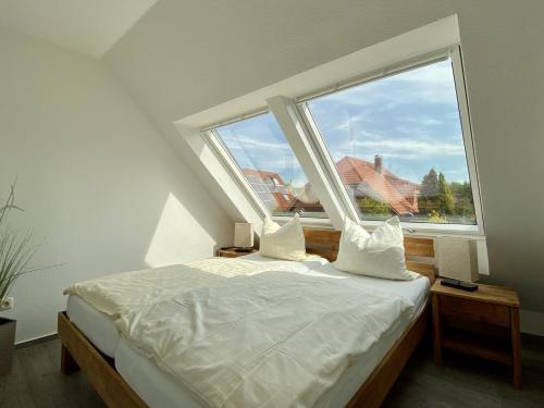 Ένα ή περισσότερα κρεβάτια σε δωμάτιο στο Dat Ferienhus Norddeich Ferienwohnung 5