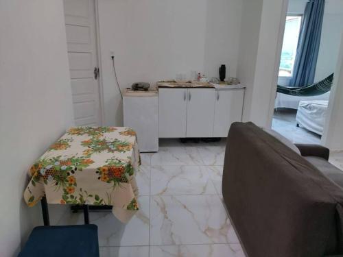 a living room with a couch and a table at Joia Centro Manaus - Apartamento in Manaus