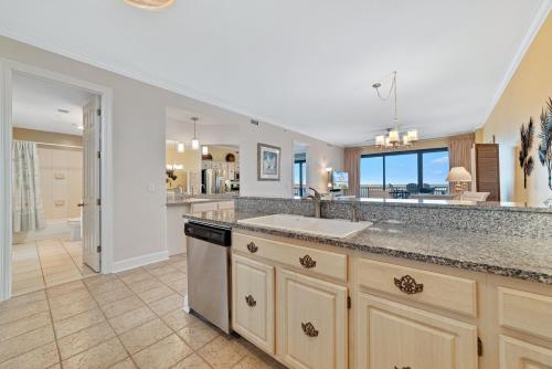 a kitchen with a sink and a counter top at Grand Pointe Unit 303 in Orange Beach