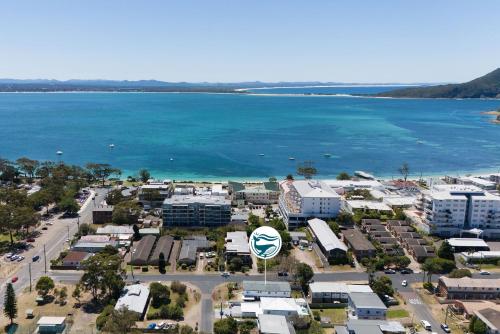 an aerial view of a town next to the ocean at Shoal Bay Beach House One in Shoal Bay