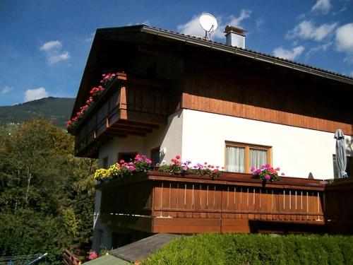a house with flowers on the balcony of it at Haus Schröer in Schruns