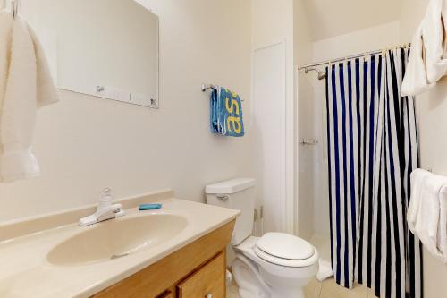 a bathroom with a sink and a toilet and a shower at The Cabins at Filoha Meadows in Redstone