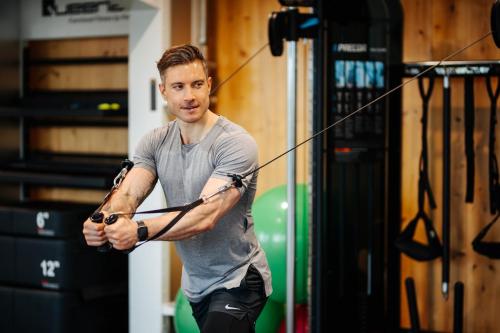 a man is holding a bow and arrow at Das Seepark Wörthersee Resort in Klagenfurt