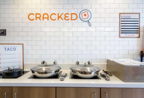two pans sitting on a counter in a kitchen at Sonesta ES Suites Denver South Park Meadows in Lone Tree