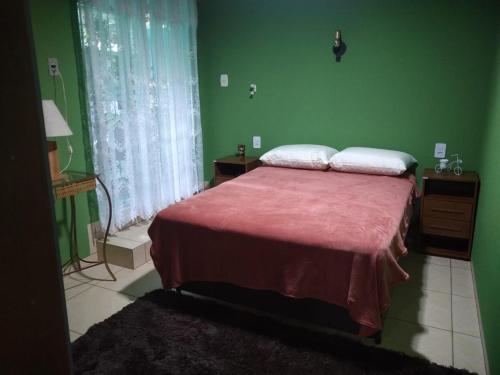 Katil atau katil-katil dalam bilik di Casa em Pomerode_SC