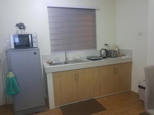 Кухня или мини-кухня в SAN REMO OASIS 2BR COMFORT 30sqm
