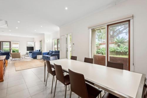 a dining room with a table and chairs at Bayti Retreat in Queenscliff