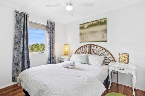 a bedroom with a bed and a window at Esplanade Absolute Beach Frontage 12-20 in Torquay