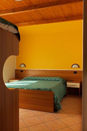 Cama o camas de una habitación en Albergo Ristorante Innocenti