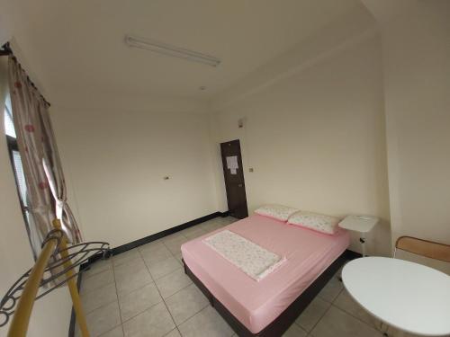 Postel nebo postele na pokoji v ubytování Huan Bei 88 Homestay