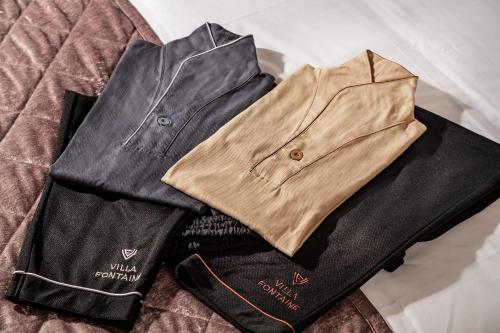 a pile of clothes sitting on a table at Villa Fontaine Grand Tokyo Ariake in Tokyo