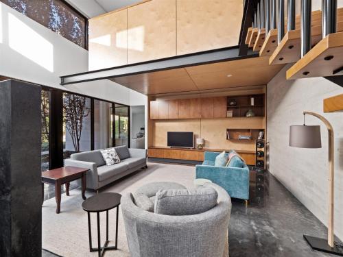 a living room with two couches and a tv at SpaceNature in Margaret River Town