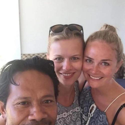 a man and two women posing for a picture at AMIGOS BUNGALOWS GILI MENO in Gili Meno